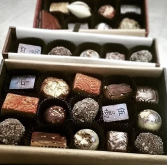 Boxes of assorted fine chocolates, each with a different mix
